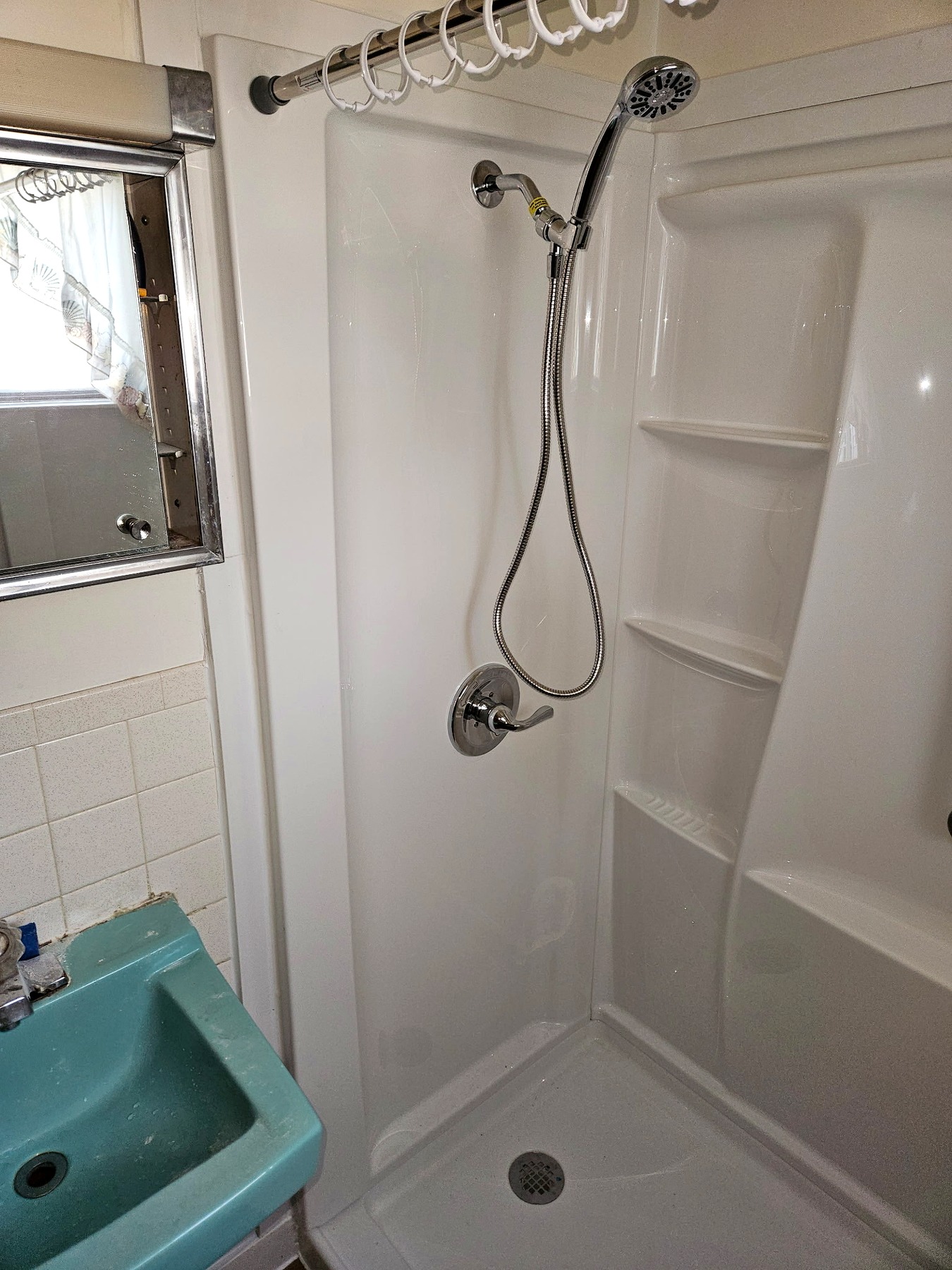 Completed shower with handheld showerhead